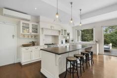 2 Kyarra St Hampton VIC 3188 $2,850,000 - $3,050,000 Absolutely gorgeous Hamptons style Californian Bungalow in prime position. With 4 bedrooms, study, 2 bathrooms, 3 living zones & alfresco deck overlooking a beautiful pool, this sunlit family home offers a breathtaking blend of luxury & period perfection. - 3 beautiful entertaining zones (gas log fire) - Hamptons style marble kitchen with timber island & WI pantry - Smeg 900mm stove, Miele dishwasher - Elevated alfresco deck (BBQ kitchen) overlooking pool - Sumptuous pool surrounded by bluestone pavers - Ducted heating, evaporative cooling & air conditioning - Leadlights, high ornate ceilings & plantation shutters - Parking for two plus utility courtyard - Metres to Gypsy Village Park and the beach - Minutes to Haileybury and St Leonard's College
