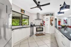 13 Cribwood Close Mount Sheridan QLD 4868 $799,000 Don't miss this opportunity to secure this perfectly perched, elevated family residence in higher Forest Gardens, Upper Mount Sheridan, Cairns which captures all the summer breezes and boasts magical views. Therese Plath proudly presents to the market this stunning four bedroom, 2 bathroom two-storey executive family home. This residence is ideally located in a private cul-de-sac and occupies a prime block so close to private and public schools, shopping centres, medical centre and surrounded by parklands and walking tracks. Forest Gardens always continues to attract residents as it is an easy 15 minutes to Cairns City Centre. Built in 2009 this home has internal access from the double remote garage and extra storage under the stairs. First class finishes, with neutral tones, complement the exceptionally well planned floor layout to create a comfortable abode. Built for the entertainer and perfect for your family, take advantage of the air-conditioned expansive open plan living area and fabulous kitchen. Banks of windows and doors allow a wealth of natural light and breezes to flow through. Leading your way up the stairs into the heart of the home you will find the expansive open plan living boasting a spacious lounge and dining area, as well as the modern kitchen that is at the forefront of design. Blending seamlessly with the outdoor undercover patio, the perfect paradise to lounge in tranquillity or entertain under the stars. The large, well-appointed modern kitchen demonstrates superior fit and finish an absolute culinary delight for those who love to cook. This gourmet space open to the living and dining areas and has stainless steel appliances with double oven, gas cooktop, dishwasher and plenty of bench and cupboard spaces. The views from this point are gorgeous to the sparkling city lights by night and the picturesque mountains. Offering four bedrooms, all spacious, carpeted and air-conditioned with the main bedroom having their very own walk in robe and large private en-suite and tiled patio overlooking the established gardens. The main bathroom services the other three bedrooms with large corner bath, single vanity and shower and is conveniently located. Other features include, but are not limited to: security screens fully air conditioned internal laundry with adequate cupboard and bench spaces Shed to rear - perfect for gardening gear Water tank