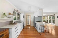 15 Tara Drive Frankston VIC 3199 $1,050,000 - $1,150,000 Striking and streamlined, geometric lines rest beyond a native landscape where a bright and breezy atmosphere elevates family living in the heart of the FHSZ. Boasting bay views and timber floors, this four bedroom abode welcomes incredible appeal in the heart of the south of Frankston for buyers of all kinds. Uniting the warmth of an open fireplace with north-facing light, an intentionally zoned double-storey floor plan reveals an immediate family focus across a collection of flexible living spaces. Welcomed by a formal lounge and study space, a meals area and family zone unite through a stone-topped kitchen alluring the home chef with garden aspects and a sweep of modern appliances. Established gardens wrap the covered verandah to present a tranquil and private outdoor entertaining zone, where children can remain in full view across the rear yard. Basking in street views, the ground floor master bedroom (built-in robes) is positioned next to a dedicated study nook with three additional bedrooms perched above. Natural light and neutral hues cascade from upstairs down, where bathrooms on each floor offer functionality and ease. Ample off-street parking for the boat/caravan, paved areas and grassy play space present an easy-care landscape, whilst inside, gas ducted heating and split-system air conditioning ensure year round comfort. Central to all, a short walk reveals the many spoils of Frankston's vibrant community from retail and public transport to education and recreational delight including but not limited to; Overport Primary School, Frankston High School, Delacombe Park Playground, Frankston Beach and George Pentland Botanic Gardens.
