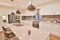16 Henrys Run Drive Mildura VIC 3500 $899,000 - $988,000 Principal & Elite Sales Agent at Ray White Mildura Damian Portaro is proud to present for sale all the style and elegance of a brand-new home with this 2020-built abode by Lockstar Homes. Soaring 9-foot ceilings flow overhead, paired with an abundance of natural light and a family-friendly floorplan. The three guest bedrooms are tucked away in their own wing alongside the main bathroom, while the owner's suite enjoys unparalleled privacy at the front of the home. A walk-in robe and a spa-inspired ensuite with a soaking tub make this a true retreat. The heart of this home is the kitchen with stone benchtops, a server's pantry and a 900mm free-standing oven as well as views over the family and dining area. A separate lounge adds flexibility and there is also an office for those who work from home. Ceiling fans and reverse cycle heating and cooling promise year-round climate control and there is also a powder room for guests and an abundance of storage throughout. Sliding doors invite you to step out to the beautiful alfresco with a timber-lined ceiling, recessed lighting and a ceiling fan to ensure complete comfort. You can relax with friends as you fire up the BBQ or step down to the fire pit area and roast marshmallows as the sun sets on another day in paradise. Expanses of lush lawn welcome the green thumb with big plans for veggie patches and chickens or you can simply relish the space and privacy on offer thanks to the 2,001sqm block. For the DIY enthusiast, there is a large approx. 11x6m shed while the long list of extra features includes a two-car garage, an automatic sprinkler system and side access with a second crossover for access.