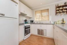 1/32 Plantation Street Mildura VIC 3500 $290,000 - $319,000 Team Hermans at Ray White Mildura proudly presents for sale this neat as a pin, spacious and stand-alone brick veneer townhouse. Positioned within a popular locale just minutes from the Fifteenth Street this property is set upon a generous 459sqm allotment with no active owners corporation. Comprising 2 good sized bedrooms, both with built in robes and ceiling fans, plus a functional open plan layout with updated flooring and neutral tones throughout, this light filled property will attract an owner occupier or investor alike. The well equipped kitchen offers gas cooking and dishwasher whilst the home is serviced by evaporative cooling and gas heating ensuring comfort throughout every season. Outside will impress with the spacious entertaining area and secure, well maintained yard plus a double carport. Rental Appraisal is $300 per week.