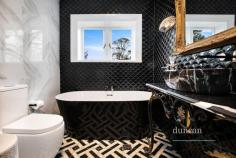 2 Albert St Bowral NSW 2576 Bidura, reminiscent of Gatsby-era splendour, offers the discerning buyer a home of grand proportions, luxurious spacious living and beautifully appointed new bathrooms and kitchen. The interior boasts high ceilings, original fireplaces and black-japanned kauri pine floors. Statement lighting, designer bathrooms, and a soft modern colour palette make for an interesting fusion of modern-meets-historic beauty. Bidura will capture your heart with its vast, established gardens amidst peaceful, beautiful district views across to Mt Gibraltar, centrally located in historic Bowral. Elegant formal living and dining areas and a stunning designer kitchen showcasing Gaggenau appliances, complete with wine room, make for perfect, easy entertaining. Flowing on from the kitchen is a sky-lit, airy breakfast and living area leading out to a large terrace. There are five bedrooms, four of which lead off the main hallway and another perfect for older children or guests. There are three bathrooms in the house, one of which is the stunning ensuite leading off the main bedroom. A beautiful, sunbathed room at the front of the house makes for the perfect office with uninterrupted views of the vast, established garden and heritage listed croquet lawn surrounded by a grand circular driveway. Hydronic heating is found throughout. The home, although vast in proportions, is comfortably warm. Open fireplaces grace three of the bedrooms in addition to the formal living areas. Upstairs leads to a large yet welcoming media room. Other features include a mud room and spacious laundry located beyond the kitchen area leading out to an outdoor lavatory, and multiple storage areas attached to the garage. Interior Design and Garden Styling by Jade Cosgrove. The Property Features: Elegant formal lounge and dining Stunning kitchen with Gaggenau appliances and separate wine room Conservatory-style casual family living and breakfast area Five bedrooms - master bedroom with ensuite Three bathrooms Upstairs media room Conservatory-style office/sunroom Rear entertaining terrace Large front verandah Mud Room Laundry Outdoor Lavatory Storerooms and Garage Working fireplaces and Hydronic heating throughout Stunning original black-japanned kauri pine floors Decorative ceilings Original slate roof