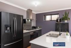 186 Dalmilling Dr The Vines WA 6069 $349,000 Elevated behind a white picket fence and a nature strip that broadens out to merge with a neighbouring park, this 3-bedroom 2-bathroom home is a picture of perfection. The 2020-built brick and iron residence uses an open plan living zone flowing into a sunny, north-facing courtyard to deliver seamless indoor-outdoor living. Nearby parks, walkways, and the Swan Valley’s gourmet delights offer an enviable lifestyle at home and away. 3 bedrooms 2 bathrooms 2020-built brick and iron Indoor-outdoor floorplan OP kitchen living meals Modern colour scheme Central courtyard garden Dble auto enclosed carport Reticulation front & rear 225 sqm “cottage” block Blue ribbon first home A limited palette of colours and materials, a floorplan where shared and private spaces are well defined and a central outdoor living zone fashion a home designed for contemporary living with a sense of welcome and ease. Three bedrooms sit at the front of the floorplan. Two juniors with plush carpet and a wardrobe recess are arranged on either side of a shared family bathroom featuring black tapware and an on-trend colour scheme. The principal bedroom features a pair of tall windows looking across the front garden and paved patio. Completing this oasis of calm is a walk-through robe opening into an ensuite with a shower, vanity, and WC. At the rear of the plan, an expanse of open living merges with a paved courtyard to expand the functional living space. Light-hued timber-look floors and an uber-cool palette of white and charcoal give this central living zone a modern edge. An island bench with an integrated breakfast bar, stone-topped benches and a 900 mm oven with a 5-burner hob will delight the most passionate of cooks. Reverse cycle air-conditioning delivers year-round climate control to the central living zone. The north-facing courtyard is open to the remote entry, 2-car auto enclosed carport. The extra-height carport has clearance for a 4 X 4 and is accessed via a rear laneway. Move-in ready, beautifully presented and a picture-perfect first home, this easy-care, easy-living property is not to be missed.