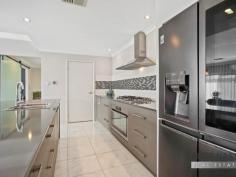 18 Ornata St Byford WA 6122 $500,000 Welcome to 18 Ornata Street Byford. This absolutely stunning super size 4×2 home is located in the highly sought after ‘Glades Estate’ situated on a family friendly low maintenance 510sqm block. With a total build area of 289m2 this gorgeous home will cater for the largest of families looking for expansive open spaces and double size bedrooms. With 3 big living areas and a stunning feature kitchen with scullery, this beauty with tick all your ‘I WANTS’ Boasting features galore this quality modern home is definitely a power house of the ‘Glades Estate’ With Woodland Grove Primary School, public open spaces just a stroll away and the Strand Lakeside Cafe and shops close, everything you need is on your doorstep, making this a highly sought after family home or investment. Selling features of this stunning home include: Fabulous street facade with portico entrance – Easy care front gardens with easy on the eye artificial lawns – Double remote garage with extra wide driveway – Feature front door with wide welcoming entrance – Shoppers entrance off the hallway – Hollywood style master suite with his and hers walk in robes – Open style feature ensuite with twin sinks separate WC and an intimate double shower – Huge theatre room with feature barn door entry – Jaw drooping open plan kitchen, meals, family and games area which is the hub of the home – Beautiful chefs kitchen with a mixture of soft closing cupboards and pot drawers, Westinghouse appliances, 5 burner gas hob, electric oven, dishwasher, double fridge recess and walk in scullery WOW – Large open plan meals, family and games area – 3 double size guest bedrooms all with built in robes – Super size guest bathroom with bath and shower – Good size laundry – Separate WC – Walk in linen – Timber decked grand alfresco and shade sail area – 2 artificial grass areas, one for the pets one for the kids – Garden shed and rear access to the backyard from the garage. Other features include: Ornate floor tiles throughout the thoroughfares and living areas – Roller shutter to the front master suite – Ducted reverse cycle air-conditioning – Attractive window treatments plus feature internal Plantation Shutters – Gas hot water system plus much more.