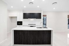 7 Loudon Parade Marsden Park NSW 2765 This 2 storey home offers ample space indoors and outdoors. This 5 bedroom home offers large light filled open plan living, dining and kitchen area with quality finishes, stainless steel appliances and gas cooking. The upper level houses has four good sized bedrooms all with built in robes, master with ensuite and upstairs living room. 1 Ensuite 4 Large Bedrooms 3 Bathrooms Built in Wardrobes to ALL Rooms / Walk Wardrobe to master bedroom Open Plan Living, Dining and Kitchen Large Outdoor Alfresco Area great for those who love to entertain! Double Lock up Garage Ducted Air-conditioning Solar Panel Internal Laundry Ample Storage Space & Much more! Positioned on the best street of the Elara estate, this beautiful family home is not to be missed. Close to the future villages, shops and local schools, this property offers fantastic opportunity for any family want to settle in this area.