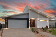 5 Barden Street Muirhead NT 0810 $775,000 This stylish modern home was quality built in 2013 and is presented in immaculate as-new condition throughout. Spacious open-plan living plus four generous bedrooms provide plenty of space for the growing family, and five-star appointments include a butler's pantry to the premium kitchen, a double therapeutic spa bath to the main bathroom, and alfresco kitchen facilities to the entertainer's patio. The home is also ideally set walking distance to parks, a childcare centre and Royal Darwin Hospital to suit the busy healthcare professional. Open-plan living, family and dining areas flow onto patio Patio with sink and gas point to suit an alfresco kitchen setup Quality gas kitchen with stone bench tops and a butler's pantry Generous master bedroom with walk-in robe and ensuite Built-in robes to good-sized second, third and fourth bedrooms Shared study/activity space off minor bedrooms for the kids Floor-to-ceiling tiles and twin vanities to ensuite and main bath Main bathroom also features a two-person therapeutic spa bath Laundry with wall-to-wall built-in storage and outdoor access Double lock-up garage with additional storage/workshop space The striking ultra-modern split skillion facade creates excellent street appeal for this impressive high-set home that combines contemporary designer quality with low-maintenance convenience. Enter via the integrated front porch and through impressive double timber front doors into the wide entry hall. The master bedroom is privately located at the front of the home off the entry hall on your right. It features a generous walk-in robe and an immaculate luxury ensuite with a twin stone-top vanity, large shower and floor-to-ceiling tiles. Continue into the main open-plan living space that consists of dining, family and lounge areas all set around the central kitchen. Wide sliding doors connect the space onto the entertainer's patio that features a sink and a BBQ gas point for easy installation of a new alfresco kitchen. Sleek black waterfall-edge stone bench tops star in the high-end kitchen that features a large island breakfast bar, premium modern cabinetry, stainless steel appliances including a gas cooktop, and a fully-equipped butler's pantry with a second sink. The second, third and fourth bedrooms share a study/activity space and join the luxurious main bathroom in a separate wing of the home off the family area at rear. All three bedrooms feature mirrored built-in robes with stylish external drawers, and the main bathroom is another standout feature of the home with a twin stone-top vanity, floor-to-ceiling tiles, shower, two-person corner spa bath and a separate toilet. There is plenty of built-in storage to the well-equipped internal laundry that features external side access, and the home is tiled and air conditioned throughout for fresh modern living. The over-sized double lock-up garage completes the package with an internal shopper's entry and additional storage/workshop space with rear access.