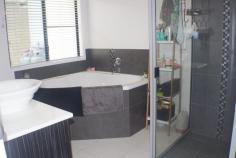 77 Canecutters Drive Ooralea QLD 4740 Beautiful on the outside, brilliant on the inside, this 4 bedroom, 2 bathroom home has it all. Fully air-conditioned with fans. The main bedroom has a 'his and her' walk in wardrobe that leads into a well appointed en-suite, it's air conditioned and carpeted. The other bedrooms are a good size and have built in wardrobes, air conditioned, and carpeted. The modern kitchen and dining area is open plan and tiled for easy cleaning and leads onto a undercover patio and entertainment area. The property is on a corner block, has a double automatic lock up garage and is protected with security screens. The easy access 6m x 6m double bay lock up shed is powered. There's plenty of room to park a caravan or boat. This well appointed home is situated within walking distance to shops, and close to the CQ University and Paget.