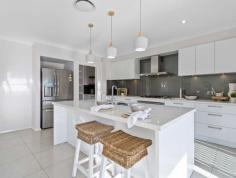 7 Jasper Avenue Hamlyn Terrace NSW 2259 $1,350,000 This incredible home oozes modern style, space and design. Located in a quiet street and surrounded by quality homes, this outstanding property is abounding with quality fixtures and features throughout and is a must to inspect. Featuring four large, open and separate living areas including home theatre that flow out onto a beautiful covered rear alfresco entertaining area with an open plan designer kitchen and butler's pantry. - Grand master suite - entry via double opening doors - feel like royalty every time you enter this supersize room leading out to own private balcony to sit and enjoy the amazing sunrise, large en-suite to relax, enjoy and unwind in luxury bath. - Four spacious bedrooms are all equipped with built in wardrobes. - 2 full bathrooms including the huge en-suite to the master and 3 toilets with downstairs powder room. - Incredible kitchen complete with 40mm stone benchtops, butlers pantry and 90cm oven plus gas cooktop. - Oversized double lockup garage plus off street parking. - Separate upstairs and downstairs study areas to accommodate 4 workstation zones. - Seamless flow from designer interiors to outdoor entertaining. - Facing East capturing beautiful sun and sea breezes. - Large, private and fully fenced back yard with ample room for in-ground swimming pool. - Ducted air conditioning throughout for year round comfort. - State of the art security system in place. Your whole family will love being conveniently located to all amenities including shops, trains, schools, M1 Motorway, Tuggerah Lakes, beaches, hospital, medical centre, nearby sporting facilities and only 1 hour from both Sydney and Newcastle. Come, sit back and enjoy life in this immaculate masterpiece. Truly one of Hamlyn Terrace's finest family homes.