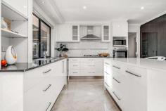 13b Andado Place Hawker ACT 2614 $1,200,000 Tucked away in a cul de sac and set amidst lush leafy gardens - exuding a strong sense of privacy and seclusion - this revived and refreshed four bedroom ensuite single level residence has emerged an exciting offering for those seeking sun filled seclusion, prime neighbourly surroundings balanced with contemporary comforts. Bearing the hallmarks of innovative modern design, sunny living spaces are segregated, yet interlocking, offering versatility in their use. Classically elegant interiors are likely to complement a wide range of furnishings. Renovated bathrooms are spacious and add to its broad appeal. Expansive full length windows to the north usher in abundant natural light, providing an ambience of warmth and flowing space, also achieving a strong connection with its picturesque grounds. A modern kitchen boasts ample cupboard and bench space, quality appliances and overlooks it's secluded yard where children can play in safety. The adjoining family room makes this the focal point of the home, extending outdoors to a enticing rear terrace. Well proportioned bedrooms each include robe space and will appeal to families seeking room to breathe and space to grow. A double attached garage with internal access and an auto garage door complete this special offering. Formal dining room Family room Kitchen (renovated 2016) with Caeserstone bench tops St George gas hot plates (4) & electric wall oven Fisher & Paykel dishwasher (two drawer) Main bedroom with walk-in robe and ensuite (updated 2016) Three additional bedrooms all with built in robes Main bathroom (renovated 2016) Double attached garage with internal access and auto panel lift door Ducted vacuum Termite protection Alarm Computerised Irrigation (6 station) Broadband connection Rinnai instantaneous hot water - Fujitsu ducted reverse cycle air-conditioning - Rinnai gas heater