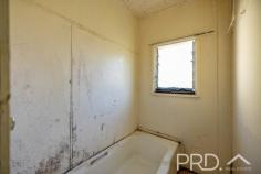 1-2 / 1 Colwell Street Tumut NSW 2720 $329,000 Located on a large corner allotment sits this dual income opportunity ready for refurb. Boasting duplex style living, comprising of a two bed one bath and one bed one bath residence, both with formal living areas and quaint fully functional kitchens. Both properties were recently tenanted long term at $270 per week total and offered with vacant possession. Allowing the incoming owner to update or refurbish. Do not miss your opportunity to secure this dual income opportunity, call today to book your private inspection! Premiere Features: - One bedroom and two-bedroom duplex style units, all three bedrooms with timber flooring - Both kitchens galley style with electric cooktops, storage options and located off the living - Great size living areas with timber flooring - Bathrooms with shower over baths, single vanity and toilet - External rear access from two-bedroom unit to the rear yard - Covered car park for two-bedroom unit and small car covered parking for one bedroom - Shared external laundry - Rear fully covered deck overlooking the yard - 841m2 allotment