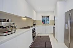 87 Kingsgrove Road Belmore NSW 2192 Ideally located on the border of Belmore and Kingsgrove, this impeccable full-brick residence delivers an instantly appealing family home, soaked in abundant light on a convenient single-level layout with an extra-wide frontage of 19.46m. Offering easy access to a choice of local schools and restaurants in Belmore, Kingsgrove and Clemton Park, just minutes to M5 access, it presents excellent value and is ready for the growing family to move straight in and enjoy. – Three (3) generous bedrooms, two with built-in wardrobes and two air-conditioners – Immaculate kitchen with Stone benchtops, 5-burner gas stove and natural skylight – Stainless steel Westinghouse appliances, dishwasher and glass splashback – Open living area with ornate fireplace, high ceilings and air-conditioner – Beautiful porcelain tiles throughout with timber floorboards in bedrooms – Separate dining room with arched bar alcove and ample natural light – Neatly landscaped front & rear yards with paved entertaining area – Fully-tiled bathroom with bathtub and separate laundry with second WC – Wide side driveway to lock-up-garage with off-street parking for 2-3 cars – Short distance to Belmore IGA, Clemton Park Coles and Kingsgrove Woolies – 5 minutes to Belmore & Kingsgrove stations, M5 access and bus connections – Close to local schools and shops in Belmore, Kingsgrove and Clemton Park