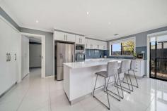 11 Marie Pitt Street Franklin ACT 2913 $1,100,000 Presenting an exciting opportunity for you to call this lovely property home. Positioned in a quiet street in the family friendly suburb of Franklin. Welcomed by contemporary interiors and a functional open plan layout. It is evident that this home will be enjoyed most by those who love to host their family and friends. Offering spacious formal and informal living areas, with a generous open plan kitchen at the heart of the home. All five bedrooms are a good size, with a generous master suite including ensuite and access to the back garden. Complementing the lovely indoor living is the homes' outdoor entertaining area, including two gorgeous entertaining decks and vast lawn edged with meticulously landscaped garden beds. Perfect for your growing family. As the new owner of this lovely home you will enjoy all the conveniences of the wonderful suburb of Franklin. Within close proximity to local bike paths, walking tracks and the Franklin Pond. As well as the popular Franklin School and Franklin Shopping Precinct both nearby. Perfectly positioned in Franklin is this lovely family home Offering a functional, single level, five bedroom floorplan All five bedrooms are carpeted and have built-in robes Master bedroom includes ensuite and access to the back garden Bathroom is a great size, including bathtub and separate toilet New vanities installed to both bathrooms and cabinetry to laundry Kitchen has extensive storage, bench space and breakfast bar Ducted gas heating with add-on cooling throughout Formal lounge is segregated at the front of the home Family / dining room is open plan and filled with great natural light Entertaining decks provide great outdoor living options Garden is perfectly set up with lush lawns and landscaped garden beds Double car garage with internal access and access to the back garden A short drive / walk into Franklin's local shops and schools Easy access to light rail stop into both Gungahlin and the city