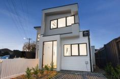 94 Alexander St Footscray VIC 3011 $850,000 - $900,000 This modern, cosmopolitan home fuses contemporary and low maintenance living to create the ultimate townhouse lifestyle. Located in the burgeoning suburb of Seddon, with its own street frontage, the value and appeal of this home is only set to grow. Upon entry to the home, you are greeted with bright spaces and impressive timber floors. The open plan living and dining area is an entertainer’s dream, this zone opens to the private courtyard, creating a peaceful ambience by bringing the outdoors in. The heart of the home, the kitchen, is sure to impress with grand proportions. It features a smoke mirror splashback, gas cooktop, stone benchtops, a double sink, island bench/breakfast bar, and ample storage space. The lower level is completed by a light-filled study, allowing for pleasant work from home situations. The airy master suite on the upper level is serviced by an ensuite with a large shower and vanity with storage. The second bedroom has ample space and overlooks the street below, making it the perfect place to unwind after a long day. This bedroom is serviced by the central bathroom that is wrapped with neutral tones and features a shower and vanity with storage. Located approximately 8kms from the city, enjoy an abundance of amenities at your doorstep. Middle and West Footscray train station, parklands, Victoria and Charles street shops and cafes, Footscray city and numerous schools are within a short walk. Additional features: – European laundry – Split system heating and cooling in the bedrooms and living area – Carport – Private courtyard