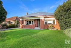 628 Thurgoona Street Albury NSW 2640 Located in the heart of Albury, this stunning red brick home has all you could ever want to make your central dream a reality. Only a short walk to the CBD of Albury, Monument Hill, Albury Botanic Gardens, and everything the region has to offer. Enjoying its elevated position on a flat 715m2 allotment, this 1930s home captures stunning views of the Albury area. The traditional styling and layout lend themselves to the three well-appointed large bedrooms with built-in storage. Finished in neutral tones and central to the bedrooms is the renovated bathroom featuring a spacious shower and single vanity. The updated kitchen is the heart of the home, offering an abundance of storage options, modern appliances, and expansive bench space. Adjacent to the kitchen, the dining area gives you a traditional luxurious feel and is the ideal place to host dinner parties or relax at the end of the day with a family meal. The main living area continues the classic feel from the polished timber floor to the large sash windows that overlook the surrounding hills and landmarks. The second living room/semi-sun room features frosted louvre windows and leads into the low-maintenance yard. In an exclusive part of Albury, this unique home offers scope to make it your own and something special or the land to develop (STCA).
