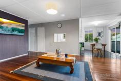 1 Esker St Pinkenba QLD 4008 $800,000 A small country town feel just 16km from the heart of Brisbane – that’s what you get with this extensively renovated highset Queenslander sitting on a massive 1004m2 corner block. The highset home comprises three good-sized bedrooms, one with a built-in robe, a bathroom with a separate shower, bath, and toilet, and an open plan living, dining, and kitchen area that opens onto a balcony. Downstairs you will find the laundry room with a toilet and shower and an extensive multipurpose/utility area. Beautiful timber floorboards flow through the upstairs area, while fretwork,VJ walls, and a smart choice in paint colour give this home the perfect blend of classic Queenslander charm and modern comfort. Window furnishings complete the picture. Extensive renovations mean the work has been done for you! The property has been professionally surveyed, and exterior renovations include roof restoration with a lifetime guarantee, new Colorbond guttering and down pipes, stormwater drainage installation and new water main from meter to house, a fresh coat of paint, security lights, new concrete paths and driveway, and footings under the perimeter of the driveway allowing for future approved carport with electrical conduit already installed. Inside, you will find a full kitchen and bathroom renovation, including a partial plumbing and drainage upgrade, air conditioning systems on both levels that discharge into storm drains, a recently replaced electric hot water system (4 years), and upgrades to the utility area under the house. The huge backyard has enough space to add a pool, an alfresco area, extend the house, and have room for the kids to play a game of backyard cricket and the dog to run around on the grass. Framed by an established garden, an irrigation system for the lawn ensures upkeep is very low maintenance. Situated in the little pocket of Pinkenba, keen fishermen and boaties will love that the boat ramp is just two minutes down the road, giving you direct access to Moreton Bay, Moreton Island, and St Helena Island. Do you drive around Brisbane for work? Pinkenba provides excellent connectivity to all parts of the city with the nearby inner-city bypass and east-west arterial tunnels, connecting you to the east, west, and southern suburbs and the Gateway arterial. The International and Domestic Airports are also nearby, perfect for the frequent traveller. DFO and Woolworths are just a 10-minute drive away for all your shopping needs, while Hamilton Wharf, with its famed Eat Street and City Cat ferries, is also a 10-minute drive. This property is ready for you to move in straight away, so whether you’re an owner-occupier or an investor, you will want to add it to your ‘must-see’ list. OUR FAVOURITE FEATURES : • Renovated highset Queenlander on 1004m2 block • Country-town feel only 16km from Brisbane CBD • 3 beds + 1 bath + WC + open living, dining, kitchen • Downstairs laundry with toilet + updated utility area • Timber floorboards, renovated kitchen & bathroom • Air conditioning & window furnishings throughout • Renovated roof, new guttering, new stormwater drainage • New paths & driveway, new lights, fresh coat of paint • Backyard fully fenced – new fence & automatic gate • Huge backyard, low maintenance gardens, irrigation • Near boat ramp, easy boat access to Moreton Bay • Close to arterial roads for excellent city connectivity • 10 mins to Woolworths & DFO, Hamilton Wharf • Ready now – great first home or investment property