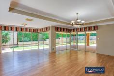 535 Horwood Rd Swan View WA 6056 $799,000 Options here with R12.5 zoning delivering the possibility to create a dual occupancy (STCA), subdivide now or later at the top of this elevated lot. Do it now or save it till later. Open the door to light filled living in this generously proportioned family home. Multiple living areas, easy – care landscaped gardens, and a large sheltered outdoor entertainment zone give a growing family flexibility. 4 bedrooms 2 bathrooms 2006 Summit brick & iron Open Plan central living Family-sized media room Separate activity room Main suite WI robe ensuite North-facing paved alfresco Easy-care landscaped gdns 1733 sqm with R12.5 zoning Close schools trail nat park Timber-look floors carry you along a wide central hallway past the spacious main suite, a separate media room, and on to a kitchen/meals/ family room arranged at the rear of the floorplan. Double doors connect this central living area to a separate activity room, while a sliding door to the large, north-facing alfresco entertaining creates seamless indoor-outdoor living. The galley-style kitchen features a long benchtop with an integrated breakfast bar, an electric oven, a 4-burner gas hob, and a dishwasher. Large windows fill this family hub with garden views and access to a paved outdoor living area surrounded by lawn, stone walls and a green screen of neatly clipped trees. An electric log fire at one corner of the open plan living space and ducted evaporative cooling throughout the home provide year-round comfort. The main suite sits at the front of the floor plan to offer a sense of privacy. Timber-look floors, timber blinds, and generous proportions create a calm and inviting parents’ retreat. A walk-in robe, split system air conditioner, and an ensuite with a separate WC bring comfort and convenience. A sense of space and pampering continues in the large media room, where plush carpet and ample room for a big screen and family-sized sofa set the stage for at-home movie nights. In the separate junior wing, three newly carpet bedrooms with built-in robes, a shared family bathroom with tub, shower, and vanity, and a separate WC give kids of all ages a space of their own. Family life can be hectic; this home is designed to make your days a little easier: a double garage with automatic entry, nearby schools, links to arterial roads, and easy access to walking and riding trails. And with the potential for subdivision or dual occupancy (STCA), multi-generational living or additional income could bring further benefits.