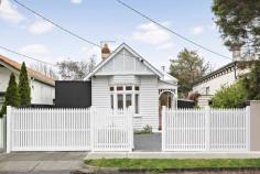 12 John St Elwood VIC 3184 $2,900,000 - $3,100,000 Sited on a double-fronted block, this builder's-own freestanding Edwardian has been superbly renovated and extended with uncompromised comfort and craftsmanship throughout its single-level design. The original façade has been retained and the interior transformed only 12 months ago into a spectacular contemporary domain perfectly attuned to modern lifestyle desires. With high ceilings carried throughout, the home's impressively proportioned floorplan showcases a show-stopping living and dining room with a luxurious amount of space, endless streams of natural light, and soaring sloped ceilings adding fantastic vertical volume. There's also a wood heater to unwind in idyllic fashion during those cooler months. Anchoring the lofty airy space is a sky-lit gourmet kitchen making it easy to indulge your culinary skills thanks to its precision functionality and the high-end inclusions of a centerpiece island bench/breakfast, white marble surfaces, Blum cabinetry, dual pyrolytic ovens, induction and gas cooktops, fridge plumbing provision, and a butler's pantry with additional sink. At the front of the home, the five-star main bedroom offers a private retreat with a window seat and a walk-through robe to a sensational ensuite bathroom with double shower and twin vanities. Three additional bedrooms are serviced by an equally stylish family bathroom with bathtub and shower. A peaceful north-facing deck and rear garden offer exceptional alfresco entertaining and relaxation complemented by the rustic brick and black cladding adorning the rear façade. The residence also benefits from a fitted home office which can be closed off for working without distraction, a full laundry room, 16kw ducted reverse-cycle heating and cooling, floor heating in the two bathrooms, extensive 8 x3 m plastered roof storage, top-of-the-range 6mm European Oak floorboards, high-quality wool carpets, Franke tapware, CCTV security, built-in speakers indoors and out, and prized off-street parking for two cars. Giving it a 'brand-new edge, the home has also been rewired, replumbed and reinsulated and fitted with a new sewer, storm water and roof. Stroll in any direction to find a fantastic selection of lifestyle amenities, including Elwood Primary and College, St Columba's Primary School, Brighton Road trams, Tennyson Village, Ripponlea Village and Station, Elsternwick Park, St Kilda Botanical Gardens, and Elwood Beach.