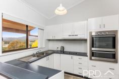 78 Howick Street Tumut NSW 2720 $499,000 Set out over two levels and with recently fully refurbished internals, you will love this highset family home with an elevated aspect overlooking the picturesque township of Tumut and surrounds. Boasting four bedrooms, two bathrooms and a flexible free flowing floor plan, both upstairs and down, all capitalising on the elevated aspect. With the rear deck running the entirety of the upper level, wrapping round to your privately positioned outdoor entertaining area. Don't miss your opportunity to secure such a great family home, call today to book your inspection. Premiere Features: - Four bedrooms, master boasting ensuite with shower, toilet and single vanity and three equipped with their very own split system air conditioning - Main bathroom with separate bath, shower and single vanity - Separate toilet - Perfectly positioned kitchen with stainless appliances, capitalising on the elevated outlook and free flowing upper-level design, overlooking the rear yard - Open plan living and dining all overlooking the rear deck and outlook - Privately positioned study on the upper level - Downstairs laundry and multi-purpose area with external rear yard access - Fourth bedroom downstairs, also with external access and split air conditioning - Additional study/storage area down stairs with external access - Landscaped and terraced rear yard, fully fenced - Garden/tool shedding built in under house - Single carport - 708m2 elevated allotment - Gas mains available with meter on-site
