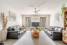 5 Sundew Close Gulmarrad NSW 2463 This stunning home is set on a large 4375m2 block, located in the ever-popular Gulmarrad area situated on the mid north coast of NSW. With a beautiful natural bush backdrop, privacy is assured with the nature reserve running along the back of the property. This is the perfect setting for this modern 4 bedroom home which is both accommodating and stylish, giving off great vibes whilst catering for the needs of a modern day family. A natural colour scheme throughout the home will compliment most furnishings and decor and the spacious design caters to the needs of a growing family, with an open plan living area that includes a contemporary kitchen, dining and family area with access to a large covered entertaining area via two large glass double sliding doors. An ideal place where you could no doubt spend a lot of time relaxing in the outdoor spa looking out onto nature and the dark skies and enjoy entertaining friends and family. Alternatively, after a long day you could just lay back in the comfort of your own media room and watch a good movie. Offering double doors to close off the space from the rest of the home, all you need is a big screen TV and some surround sound speakers and the mood is set for your own home theatre. Afterwards retreat to the huge master bedroom, featuring an attractive large ensuite with separate toilet plus a walk-in robe and sliding door access to the covered entertaining area, so you could sneak out for a late night spa without disturbing the rest of the household. Also located away from the main living areas are the other 3 bedrooms offering built-in-robes, ceiling fans and easy access to the main bathroom and laundry area. In addition to the double garage attached to the home there is a separate 4 bay colorbond shed with power, plus there is a gravel driveway to both. Another bonus is the Solar Hot Water System and 6kw Solar Power and established gardens and lawns.
