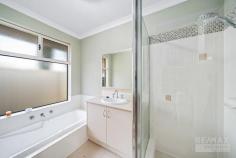 28 Enfield Turn Carramar WA 6031 $600,000 This stunning 4-bedroom, 2-bathroom, property ticks all the boxes! Features & benefits include: * Double door entry with crim-safe screens * Home theatre / formal lounge * Master bedroom with walk in robe, ceiling fan & renovated ensuite with twin vanities, shower & separate powder room with access from the hall * Spacious study / 5th bedroom * Open plan family, meals & games areas * Kitchen with fridge recess, pantry, shoppers access from the garage & stainless steel oven, cooktop & dishwasher * 3 further spacious bedrooms with built in, mirrored robes * Family bathroom with vanity, bath & shower * 2nd WC * Laundry * Quality wood flooring * Alarm system * Reverse cycle, zoned air conditioning for year round comfort * 3.78 kw (12 Panels) Solar Electricity system to cut down on power bills * ENVIRO HEAT Heat Pump Energy efficient hot water system * Outdoor, undercover entertainment area * Sparkling, solar heated pool * 2 Garden sheds, one with power * Double, remote garage with roller door access to the rear * 601sqm block * Close to parks, schools, shops, The Duke Bar & Bistro, transport & all other local amenities