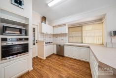 63 Balladong Loop Carramar WA 6031 $599,000 If you have been searching for a property with space for the cars, boat, caravan & toys, that has full drive through access to undercover parking & a huge, powered brick-built garage / workshop, this is it! Features & benefits include: * Entrance hall * Formal lounge / dining * Master bedroom with walk in robe, split system air conditioning & ensuite with vanity, shower & WC * Open plan family & meals areas * Kitchen with stainless steel oven & dishwasher, 900mm gas cook top, microwave recess, pantry, and shoppers’ access from the garage * Games room * 2 further spacious bedrooms with built robes * Family bathroom with vanity, bath & shower * 2nd WC * Laundry * Walk in linen cupboard * Utility Room * Ducted air conditioning * Ducted gas heating * Skirting boards * Security screens * Large, undercover entertainment area with drive through access * Huge, powered, brick workshop with remote roller door (potential to convert into a granny flat / studio / work from home space) * Double, remote garage with rear drive through access to workshop * Large 670sqm block * Close to schools, shops, parks, transport & all other local amenities