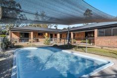 32 Clyde Essex Drive Gulmarrad NSW 2463 $960,000 32 Clyde Essex Drive is located in a sought after area of Gulmarrad where the lots surrounding this property are all larger than the average acre block. This gives you a sense of space and privacy in a lovely semi-rural setting. This solid double brick home offers concrete flooring and 9 foot timber ceilings and timber plantation shutters throughout the home that gives it a warm and rustic feel. The design of this home is a little different and one of a kind from the typical homes in Gulmarrad and offers a great set-up for living with aging parents, independent children or even a second income. The main area of the home offers a private entrance, large air-conditioned open plan kitchen and living area, 3 king size bedrooms all with floor to ceiling built-in-robes plus ceiling fans. A bright and spacious bathroom with separate toilet and laundry area. There is a large double garage with internal access into the living area plus a sun-room. Separated by an internal door is the second area of the home with its own air-conditioned open plan living and kitchen space, large bedroom with air-conditioning, built-in-robe and ceiling fan. There is a 2nd smaller bedroom or study plus bathroom. Both of the living areas have separate sliding glass doors that lead you into the courtyard with an in-ground pool that can be enjoyed by all. This property also offers plenty of room for all your animals, even a pony as there is a fenced paddock with shelter plus chicken pen, or you could build the shed of your dreams. Gulmarrad is becoming a very popular choice for a lifestyle change on the Mid-north Coast of NSW, offering quality homes on small acreage. Nestled between the beautiful riverside township of Maclean and the stunning coastline of both Yamba and Brooms Head, and lets not forget about the mighty Clarence River where you can spend time exploring the pristine waterways. Located less than a 2 hour drive to Tweed Heads and the international air-port.