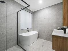 4 Conto Ave Dianella WA 6059 Bespoke. Innovative. Easy-Care. The three adjectives we would use to best describe this stunning Dianella abode. Custom built by a local boutique builder, and situated in the heart of this highly sought after suburb, just minutes from shops, parks, cafes, schools and public transport, this flawless 3 or 4 bedroom plus study, 2 bathroom family home sits in a class of its own. Undoubtedly THE BEST, BRAND NEW, GREEN TITLED, STREET FRONT HOME currently available in the area, it effortlessly blends form with function to deliver a lifestyle without compromise! Set behind a STRIKING modern FACADE, where bold architectural lines and a timeless monochromatic colour palette contrast beautifully against the mature green planting, the extra wide washed aggregate driveway and pathways, private entry portico with recessed timber look ceiling and custom glass front door are subtle reminders of the quality that lies beyond. Inside, a classically elegant, restrained palette of neutral toned elements work in symphony with the extra high 32c ceilings to create a BRIGHT & AIRY FEEL you’re bound to love. Graced with sleek stone look porcelain tiles underfoot, the wide central hallway connects each zone beautifully, acting as the central spine of the home. Practically designed for everyday living, you even have a recessed “drop” nook halfway along with built-in drawers & mirror, perfect for keys and phones so you don’t forget them on the way out! Built around entertaining, the VAST OPEN PLAN KITCHEN, DINING AND LIVING area is where you will spend most of your time, with glass sliding doors opening up the space onto the stunning rear alfresco and maintenance free backyard. The commodious living area itself provides ample room for everybody to kick back and relax, whilst the adjoining dining room will easily accommodate an 8-10 seater table and is the perfect spot for your next dinner party. Wrap around windows drench the entire space in glorious natural light, whilst recessed ceilings, stone look floor tiles, back lit wall light and a bespoke “Tonachino” plastered feature wall add a touch of class. Custom sheer curtains soften the room beautifully. Bound to leave the resident chef salivating, the LAVISHLY APPOINTED KITCHEN is a true culinary delight. Complete with stone benchtops and splashbacks, top of the range “Inalt” appliances (including a wide 5 burner gas cooktop with rangehood and twin wall mounted ovens), a plethora of soft closing cabinets and huge island bench with waterfall edge and breakfast bar, you even have the luxury of an adjoining butlers pantry. Equally well appointed with stone benchtops and splashbacks, “Franke” black double sink with “Vita Bertoni” flick mixer and pull down spray tap, dishwasher recess, fridge/freezer recess and even more built in storage (!), it's the perfect spot for concealing all your mess when guests arrive.