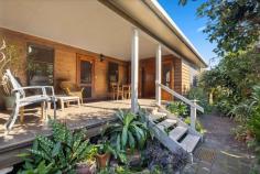 22 Schafer Street Red Rock NSW 2456 $1,150,000 Living the idyllic beachside village lifestyle will be made easy in this unique coastal home. With boating, fishing and leisure all at your fingertips and located just a few minutes walk from the Red Rock headland, beautiful beaches and the picturesque riverfront, this thoughtfully designed timber cottage is being offered to the market for the very first time. From the moment you step through the door you will appreciate the craftsmanship and character this property holds. The spacious open plan living area is air conditioned and features high timber ceilings and timber flooring, offering a light and airy sense of space throughout. The cook of the family will be comfortable in the spacious well-appointed timber kitchen- boasting gas cooking, breakfast bar and ample storage space. Two internal bedrooms feature built-in robes and the master opens onto the large undercover front deck, the perfect place to enjoy your coffee in the morning sun. The bathroom offers a large tub and separate toilet, plus custom timber vanity with ornate sink to keep with the theme and character of the home. The third bedroom is accessed via the covered back deck and offers the opportunity to be used as guest accommodation or an office for a home business with private access via the side of the property. Potential to make an income through AirBnb is on offer, with a studio at the rear of the property offering a kitchenette, living area and a generous loft space. Other features include: Single lock up garage with additional storage space Single carport Hot and cold outdoor shower Outdoor toilet Internal laundry with storage Well established gardens Fenced backyard Garden shed for storage Located just a 15 minute drive to the facilities, cafes, restaurants and shopping that Woolgoolga has to offer and only 30 minutes to Coffs Harbour or Grafton, Red Rock offers a laid back and peaceful family friendly setting for picnics, swimming, canoeing, kayaking, boating and fishing.