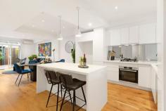 129 Westbourne Rd Kensington VIC 3031 $960,000 - $1,050,000 Showcased over three levels, this three bedroom two bathroom home has been fully updated to the pinnacle of quality, convenience and comfort. With parkland at the front door, tall trees providing shade and ringed by community greenspace, this immaculate residence is handy to everything cosmopolitan Kensington has to offer. The ground floor shines with engineered timber flooring, Daikin inverter and open plan design with glass sliding doors to the private courtyard featuring vertical garden and BBQ gas connection. The kitchen boasts Bosch appliances and a stone top waterfall island bench. Upstairs finds a luxurious main bedroom with walk-in robe and ensuite with freestanding bath and frameless walk-in rain shower. A second large bedroom has BIRs and an elongated balcony, with the top level hosting a third bedroom with a study nook offering expansive views. The central bathroom is fully tiled and contains a modern vessel sink, while a separate and sizeable home office sits alongside the single garage with automatic entry. Other quality inclusions are a downstairs powder room, under stair and roof storage, European laundry, WIFI controlled ducted heating, air conditioning units in all the bedrooms, Rinnai instantaneous hot water, quality window treatments and plush carpets.