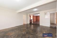 23 Markham Way Swan View WA 6056 $399,000 With expansive open plan living, a formal lounge or dining room and a terrace for outdoor entertaining, this well-presented brick and tile home delivers an excellent start for families. Set on a friendly Swan View Street, within walking distance of shopping, transport, sports and schools, the property has a fully fenced backyard with a small garden shed. 4 bedrooms 1 bathroom 1982-built brick and tile Split-level open plan living Formal lounge/dining rm Main bed w built-in robes Fully fenced backyard Sheltered alfresco living Garden shed & carport 732 sqm great location Walk to shops, transport, sports Come home to a property designed for the busy activity of family life. As you enter through the front door, open plan living extends across the floorplan to a large, sheltered outdoor entertaining zone. An extension to the original layout has fashioned a flexible shared living space with an indoor-outdoor flow. A slow combustion fireplace in the central living area and reverse cycle air conditioning in the formal lounge/dining room provide year-round comfort. A U-shaped bench with an integrated breakfast bar defines the kitchen arranged at one corner of the open plan zone; a casement opening to the formal lounge/dining room retains the sense of flow. A central hall leads to the main and two junior bedrooms, the family bathroom and a laundry with a separate WC. Both junior rooms have ceiling fans, and one has fitted robes. The main bedroom has mirror-fronted built-in robes and air conditioning. The fourth bedroom, arranged off the sunken family room, is also equipped with a ceiling fan. Double doors open to a paved terrace sheltered by a high gabled roof. This ample outdoor living space spans the rear of the home and overlooks a level lawn area with a small garden shed at one corner. Walking distance from the local shopping centre, the sporting facilities of Brown Park and hours of walking and riding along the much-loved Heritage Trail, the home is situated to make the coming and going of family life a little easier.