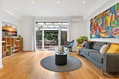 129 Westbourne Rd Kensington VIC 3031 $960,000 - $1,050,000 Showcased over three levels, this three bedroom two bathroom home has been fully updated to the pinnacle of quality, convenience and comfort. With parkland at the front door, tall trees providing shade and ringed by community greenspace, this immaculate residence is handy to everything cosmopolitan Kensington has to offer. The ground floor shines with engineered timber flooring, Daikin inverter and open plan design with glass sliding doors to the private courtyard featuring vertical garden and BBQ gas connection. The kitchen boasts Bosch appliances and a stone top waterfall island bench. Upstairs finds a luxurious main bedroom with walk-in robe and ensuite with freestanding bath and frameless walk-in rain shower. A second large bedroom has BIRs and an elongated balcony, with the top level hosting a third bedroom with a study nook offering expansive views. The central bathroom is fully tiled and contains a modern vessel sink, while a separate and sizeable home office sits alongside the single garage with automatic entry. Other quality inclusions are a downstairs powder room, under stair and roof storage, European laundry, WIFI controlled ducted heating, air conditioning units in all the bedrooms, Rinnai instantaneous hot water, quality window treatments and plush carpets.