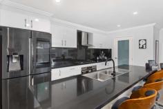 14 Skardon Terrace Albion Park NSW 2527 $1,250,000 - $1,320,000 Spacious, stylish and so brilliantly functional, this five-bedroom contemporary residence has been designed to add a touch of luxury to busy family living. Every element that's essential for home enjoyment is offered by this quality two-storey property, further accompanied by a open and airy living spaces that seamlessly integrate the heart of the home with a stylish outdoor alfresco and pool area. It makes the perfect option for those who demand style, size and position and wish to move into an expansive home in near-new condition that's centrally located to Albion Park amenities. Crisp and contemporary interiors feature quality inclusions throughout 4 spacious bedrooms, master featuring ensuite and walk-in wardrobe Well-designed floorplan offering multiple formal and casual living spaces Stunning kitchen with breakfast island and huge walk-in pantry Upstairs teenage retreat plus a ground floor guest bedroom or home office Ducted air conditioning throughout, 15kw solar system, rain water tank, garden shed A level flow to covered alfresco entertaining with BBQ, TV, bar fridges & hot/cold water In ground solar heated pool with travertine tiling, glass fencing & BOSE surround sound Top of the range CCTV system and alarm WiFi lighting, doorbell, front door lock and soft touch LED switches Double remote garage with off street parking Landscaped gardens with fruit trees, loads of yard for the kids & pets to play Within close proximity to shops, schools, cafes and restaurants An immaculate near new home ready to move into, without the headaches of a new build