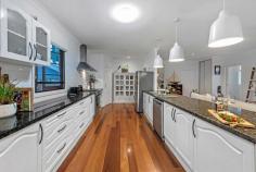 43 Finnie Rd Deagon QLD 4017 $1,200,000 This elegant contemporary home is perfectly positioned on a large 809m2 easy-care block to maximise privacy; the aspect offers effortless family-friendly living of the highest calibre within walking distance to local schools, parks, public transport, and bikeways. Across two levels, with a seamless floorplan designed to give excellent separation of living as well as wonderful light filled communal spaces. Boasting high ceilings, the luxurious galley kitchen features granite benchtops and stainless-steel appliances, including a 900mm gas cooktop, 900mm electric oven and dishwasher. Featuring a large covered entertaining deck overlooking the sparkling inground pool. Framed by delightful established gardens, with freshly mulched garden beds and luscious lawn, the outside looks just as stunning as the inside. The home comprises: Five bedrooms Two bathrooms Two separate living areas Galley kitchen Separate laundry Triple carport Huge 8x4 metre powered workshop Second garden shed Side access 16 panel solar system Gas hot water Rainwater tank Located on Brisbane's northside just a short distance to the village of Sandgate, offering bars, restaurants, and miles of bicycle/walkways along the pristine shoreline looking out to Moreton Island. The area has several quality schools, both private and state, along with day-care centres close by. Deagon is ideally located to the Gateway Motorway; an easy 30-minute commute to Brisbane CBD, just 20 minutes to Brisbane Airport, and an hour drive to the Gold or Sunshine coast.