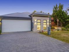 1 Menz St Embleton WA 6062 …then send out the invitations as this stunning 4 bedroom, 2 bathroom family abode with its oversized chefs’ kitchen, huge home theatre and enclosed year round alfresco is perfect! Nestled on a low maintenance 396m2 STREET FRONT block with schools, shops, parks and public transport all on your doorstep, it effortlessly blends form with function to deliver a lifestyle without compromise! WELCOME HOME to 1a Menz Street, Embleton. The ultimate entertainer’s paradise, at its heart lies a huge open plan kitchen, living and dining area, which effortlessly spills out to the enclosed rear alfresco. Bound to leave the resident chef salivating, the well-equipped kitchen is the centrepiece of the room. Boasting quality stainless steel appliances including a 5 burner gas cooktop and wall mounted oven with grill, stone benchtops, dishwasher recess, ample soft closing cabinetry, a huge walk-in scullery plus sweeping 4m breakfast bar with pendant lighting for the whole family to gravitate around, you’ll simply love cooking here, with the open plan concept ensuring no one misses out on the conversation. Adjacent to the kitchen, the vast living and dining area is bathed in natural light, with easy care German engineered timber look laminate floors another feature you’re bound to love. The living room itself offers plenty of space for your large flat screen TV and big comfy sofas, whilst the meals area can comfortably accommodate a 10-12 seater dining table. And for special occasions, up to 100 people can gather when the alfresco doors are pulled back. A virtual extension of the indoor living space, the fabulous undercover alfresco and wrap around backyard is sure to be a hit amongst all your family and friends! Completely paved for easy care maintenance, and bordered by lovely mature greenery, zip track café blinds and a ceiling fan ensure year-round comfort, whilst TV and power points provide added practicality. Back indoors, and ideal for family movie nights or taking in the big game, the separate home theatre is sure to be a crowd favourite. Complete with an impressive “coffered” ceiling, the only thing missing is the choc tops, popcorn and your favourite comfy sofa! Boasting a brilliant separation between living and sleeping quarters, the home has been thoughtfully planned for modern family living. Well proportioned, and bathed in natural light, the master suite is an ideal sanctuary to kick back and relax after a hard day's work. Complete with white plantation shutters, a large walk-in robe plus stylish ensuite, the latter boasts a wide stone topped vanity with double sinks, shower, W/C and plenty of built-in storage. The three remaining bedrooms (all with built-in robes) are a great size and come with either wooden blinds or plantation shutters for that added touch of class. Crisp and on trend, the family bathroom features an extra wide shower plus separate bathtub (perfect for the little ones), whilst tucked away at the end of the corridor is a separate powder room with hand basin, perfect for visiting guests. A well-designed laundry with generous storage, trough and direct external access rounds out this wing. Thoughtfully designed to accommodate your families every need, additional features include evaporative air-conditioning, gas hot water and heating, plenty of built-in storage, an automatic double lock up garage with ample power points, shoppers entrance and access to the rear via roller door, plus reticulated irrigation to the front. And lastly, in terms of location, it doesn’t get more convenient than this! Morley Galleria & Coventry Markets are both only minutes’ drive away, whilst for those active, the newly revamped Bayswater Waves and Morley Sport & Recreation Centre are both only a short commute. Parks, bus routes and several primary and secondary schooling options also abound, whilst for commuters, the CBD is only 10kms away and the proposed Morley Metronet Station (currently under construction) just around the corner.