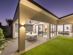 4 Conto Ave Dianella WA 6059 Bespoke. Innovative. Easy-Care. The three adjectives we would use to best describe this stunning Dianella abode. Custom built by a local boutique builder, and situated in the heart of this highly sought after suburb, just minutes from shops, parks, cafes, schools and public transport, this flawless 3 or 4 bedroom plus study, 2 bathroom family home sits in a class of its own. Undoubtedly THE BEST, BRAND NEW, GREEN TITLED, STREET FRONT HOME currently available in the area, it effortlessly blends form with function to deliver a lifestyle without compromise! Set behind a STRIKING modern FACADE, where bold architectural lines and a timeless monochromatic colour palette contrast beautifully against the mature green planting, the extra wide washed aggregate driveway and pathways, private entry portico with recessed timber look ceiling and custom glass front door are subtle reminders of the quality that lies beyond. Inside, a classically elegant, restrained palette of neutral toned elements work in symphony with the extra high 32c ceilings to create a BRIGHT & AIRY FEEL you’re bound to love. Graced with sleek stone look porcelain tiles underfoot, the wide central hallway connects each zone beautifully, acting as the central spine of the home. Practically designed for everyday living, you even have a recessed “drop” nook halfway along with built-in drawers & mirror, perfect for keys and phones so you don’t forget them on the way out! Built around entertaining, the VAST OPEN PLAN KITCHEN, DINING AND LIVING area is where you will spend most of your time, with glass sliding doors opening up the space onto the stunning rear alfresco and maintenance free backyard. The commodious living area itself provides ample room for everybody to kick back and relax, whilst the adjoining dining room will easily accommodate an 8-10 seater table and is the perfect spot for your next dinner party. Wrap around windows drench the entire space in glorious natural light, whilst recessed ceilings, stone look floor tiles, back lit wall light and a bespoke “Tonachino” plastered feature wall add a touch of class. Custom sheer curtains soften the room beautifully. Bound to leave the resident chef salivating, the LAVISHLY APPOINTED KITCHEN is a true culinary delight. Complete with stone benchtops and splashbacks, top of the range “Inalt” appliances (including a wide 5 burner gas cooktop with rangehood and twin wall mounted ovens), a plethora of soft closing cabinets and huge island bench with waterfall edge and breakfast bar, you even have the luxury of an adjoining butlers pantry. Equally well appointed with stone benchtops and splashbacks, “Franke” black double sink with “Vita Bertoni” flick mixer and pull down spray tap, dishwasher recess, fridge/freezer recess and even more built in storage (!), it's the perfect spot for concealing all your mess when guests arrive.