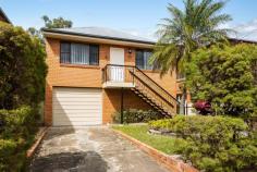 11 Gellibrand Street Clayfield QLD 4011 You need space. You need lots of room for the family, loads of storage, a wonderfully level block of land with room for a pool and more. Most of all, you need all this in a great, central location, with the city on your doorstep. Welcome to 11 Gellibrand Street. This bright and airy three-bedroom brick home is just moments from a host of shops, cafes and amenities. Multiple express buses to the CBD are just around the corner. You have your choice of railway stations: Clayfield station is just a short stroll (517m) and Eagle Junction railway is a ten-minute flat walk. No more long commutes: you’ll be in the CBD in 16 minutes! Clayfield’s long-established reputation as one of Brisbane’s premier suburbs means that you’ll have your choice of some of the city’s top schools. It’s in the catchment area for Eagle Junction State School, with many excellent private schools just minutes away. Gellibrand Street provides easy access to main arterial routes to the coast and an easy run to the airport. Step inside this well-kept property. There’s a light-filled office at the front—an ideal spot for working from home. Polished wood floors extend throughout the house. All three bedrooms feature built-in robes. There’s a spacious and welcoming living and dining area to the rear of the home. The extra-large kitchen overlooks the central area and out to the roomy back garden. Downstairs, there’s space galore. A large, tandem garage with electric door. A huge air-conditioned rumpus room that’s just perfect for a teenage retreat. There’s a shower and toilet at this level. There’s also space for an extra bedroom on the ground floor (not legal height). A large, separate laundry provides plenty of room for additional storage and appliances. If you’re looking for a spacious, bright home in an excellent inner-north location, close to all amenities, don’t miss the opportunity to view this lovely family property.