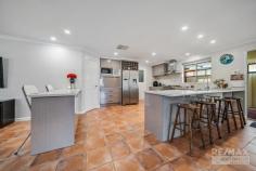 27 Whyalla Chase Tapping WA 6065 $600,000 If you’re looking for a home that has space for the whole family & ticks every box, look no further! This stunning 4/5-bedroom, 2-bathroom property will impress the most discerning of buyers. Features & benefits include: * Entrance hall * Master bedroom with walk in robe & ensuite with vanity, bath, shower & WC * Home theatre * Study / home office / 5th bedroom * Spacious, open plan family & meals areas with log burner * Chef’s kitchen with breakfast bars, corner, pantry, double fridge / freezer recess, shoppers’ access from the garage & stainless-steel appliances including dishwasher & 900mm freestanding range cooker * Games room with screen & projector * Activity room with linen cupboard * 3 further spacious bedrooms, 2 with built in robes * Family bathroom with vanity, shower & bath * Well-appointed laundry with plenty of cupboard space * 2nd WC * Ducted air conditioning * Alarm system * 3.5kw solar electricity system * Alfresco * Generous synthetic lawn area * Solar heated, below ground pool * Triple garage with drive through access for the toys * Large 620sqm block * Close to schools, parks, shops, transport & all other local amenities Located in a sought after, quiet street; be sure not to miss out.