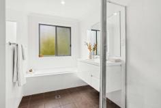 5/21 Gooyong Street Keiraville NSW 2500 $1,190,000 Designed and built on the scale of a family home, this beautiful tri-level townhouse impresses on every front. Fresh and modern throughout with an emphasis on carefree comfort, it features light-filled interiors with sleek hardwood timber floors, a stunning gas-equipped kitchen, full master quarters and north-facing alfresco entertaining. Combining wonderful peace and privacy with all the benefits of a village lifestyle, this quality property rests only a few minutes from the main Uni campus and enjoys prime proximity to shops and cafes, CBD transport links and Keiraville Public School. Features: Sought-after boutique complex of six adjoining Keira Oval Expansive open-plan layout flowing outside in two directions Low-maintenance courtyard with generous all-seasons patio Full bath plus ensuite, excellent storage in all three beds, new paint and carpet throughout 40mm stone breakfast island, guest W/C, huge double garage with storage to rear Easy access to adjoining reserve, local childcare, playground + Botanic Garden