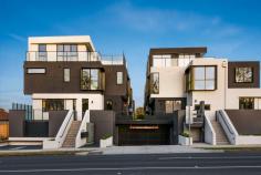5/396-398 Elgar Road Box Hill VIC 3128 Just half an hour to the Melbourne CBD, 40 minutes to St Kilda Beach and just 8 minutes walk to the centre of bustling Box Hill and the train station, this epic four level townhouse vaunts an incredible five bedrooms, multiple living zones and a sunny top floor terrace lounge with exceptional views to Box Hill and further North. Set within a small, boutique complex, these architecturally designed residences are just as appealing on the outside as they are on the inside. An oversized double tandem garage and abundance of storage are located in the basement, while the ground floor offers luxurious open-plan living and formal sitting rooms, bolstered by stunning 2700mm high ceilings, square set cornices, LED pendants and down lights, timber laminate flooring and a plenitude of natural light. The top floor showcases an opulent study and lounge that lead out to the terrace balcony that boasts amazing views. The kitchen is expectedly high-end with light oak and black contrasting laminate cabinetry, 40mm stone bench tops, custom joinery and display shelving and a deluxe glass splashback. An integrated dishwasher complements the double undermount sink with an elegant gooseneck mixer, while the wall-mounted Miele electric oven and 900mm gas burner cooktop will delight home chefs. Air-conditioned bedrooms are spaciously spread across two levels, all flaunting plentiful built-in storage and three offering private ensuites. There are four top-tier bathrooms in this home, plus a separate powder room and ensuite for guests, and the inclusions are immaculate: full height shower tiles, semi-frameless screens, stone-top vanities and frameless mirrors. This incredible lifestyle residence is within an easy walk to the centre of Box Hill which includes the train station, shopping mall and precinct, medical, dining, cafes and town amenities. Parks and playgrounds are abundant, while the 767, 767 and 281 bus routes are all accessible within approximately 200m of your front door. Property Specifications: · Five bedrooms, four levels, four living areas, stunning townhouse in a highly sought-after location · Five highly appointed bathrooms plus separate powder room for guests · Loads of internal space as well an oversized basement with double tandem garage · High ceilings, LED lights, air conditioning, luxurious flooring · Amazing rooftop terrace balcony with sensational views · Premium position close to the centre of Box Hill