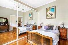 9 King St Glandore SA 5037 $1,050,000 to $1,150,000 Enjoying an enviable position along a quiet tree-lined cul-de-sac, you’ll find this renovated art deco home in wonderful company on King Street. A welcoming frontage with lovely timber-framed windows and a wide porch overlook neat front gardens and out to the street; the perfect place to muse with a morning cuppa. Generously proportioned with the distinctive high ornate ceilings, a central entrance is lined with timber floors and gives way to front positioned bedrooms on either side, including a roomy master with mirrored built-in robes and ceiling fan. A third bedroom is separated by a superbly refurbished bathroom accented with subtle neutral tones and a corner shower. Bathed in natural light, a rear family and dining area with large format tiles and a gas combustion heater is airy and open; timber framed café doors opening right up to reveal the ultimate alfresco entertaining space. Off to the side, a functional kitchen offers neutral shaker-style cabinetry, Asko dishwasher, wall oven, double sink, corner pantry, window opening onto the verandah and a servery and breakfast bar onto the family/dining. Here you’ll also find a convenient second bathroom with the charm of classic floor tiles, timber vanity and shower as well as plenty of room for all laundry facilities. A huge bonus also off the extension is a versatile extra room with split system reverse cycle air conditioner and doors directly onto the alfresco. A guest room, study, home office, fourth bedroom or additional living space, it will conveniently convert to whatever you need. Outside, entertainers will fall head over heels with the huge pergola-covered alfresco with handy outdoor sink and prime views of the perfect backyard. Endless lawn space is divided between manicured hedges, offering plenty of room for fun and games and respite for restless legs – two or four – concluding at a rear service yard with shed. More you’ll adore: - Ceiling fans + built-in robes to bedrooms 2 & 3 - Ducted evaporative cooling - Impeccable north-facing backyard - Solar panels - Secure roller door carport + plenty of extra off-street parking - The location An absolute gem of a spot just a few hundred metres from the Glandore Oval with playground, tennis courts and memorial rose garden, as well as Emerson Railway Station, the bus and local takeaway options and gyms. The highly regarded Black Forest Primary School is also within walking distance, with the Castle Plaza and Kurralta Park Shopping Centres within a couple of kilometres. Convenient to the tram and ten minutes to city; ten minutes to sea by car. What more could you ask for in a location?