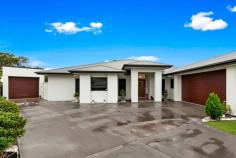 9 Kelsie Court Oakhurst QLD 4650 Multi-generational living with 6 generous bedrooms and 4 bathrooms. Style, sophistication, space and functionality blend beautifully at this impressive executive class home situated in Maryborough West, only minutes to the heart of town. This remarkable residence is only 4 years young and excels in every way, proportioned to please with 472m2* under roof. From the grand entry foyer to the expansive living areas and out to the private alfresco an enviable lifestyle awaits you and your loved ones. The home is complete with a fully self-contained flat ideal for the extended family or guest situation. Offering 6 generous bedrooms in total, 4 bathrooms (main bathroom plus 3 ensuites and two powder rooms). Featuring generous open plan living and dining area with bar, plus a huge formal lounge and generous formal dining area that create a sense of style and sophistication in the heart of the home. The spacious kitchen is a delight with Caesar-stone benchtops, 900ml free standing stove, rangehood, secondary wall oven, 2 microwave recesses, 2 drawer dishwasher and fully equipped butler's pantry. Adjoining the kitchen and living area is a bar area with glass display cabinets, dishwasher, fridge recess and all designed to flow seamlessly to the outdoor alfresco, accessed via wide bi-fold doors. The main bedroom is a true retreat, complimented by a large walk-in robe plus hidden office and a generous ensuite with walk-in shower, bath, and double vanity. All bedrooms have built-in robes and the entire home enjoys the comfort of ducted air-conditioning. The home is superbly designed with generous storage throughout including within the laundry area and a store-room that links the double bay lock up garage with the home. Vehicle accommodation for 3 vehicles in total. Other features include 35 solar panels (7.7kw* system), Security and more. There is so much to love about this property. Don't miss your chance.