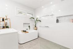 3 Hatfield Street Merewether Heights NSW 2291 Set behind lush greenery for privacy and perched atop its garaging and handy utility rooms, this beautifully renovated, hardwood framed home is designed to embrace a functional family layout with indoor/outdoor flow to a saltwater pool that invites relaxation. Perfect for the active family just 2.5km down to the beach action and 500m from Glenrock State Conservation Area's bike trails, rainforest walks and waterfalls. Stylish interiors have retained the home's gorgeous original timber floors and paired them with crisp décor and plantation shutters to channel a cool, coastal aesthetic. The spacious Caesarstone kitchen flows on from the air-conditioned lounge and dining area and caters perfectly for a growing family with its abundance of bench and cupboard space, quality appliances, and breakfast bar. Enjoy your morning coffee or sundowner in the delightful sunroom or entertain guests under the covered alfresco as the kids splash around in the pool. A three bedroom, two bathroom sleeping wing enjoys privacy away from the social spaces of the home. Teens will have their eye on the lower level, which features two separate rooms and a third bathroom offering a great breakout space for gaming, study or catching up with their friends. Two separate driveways, a carport and single garage has everyone's parking needs covered. This impeccably appointed home is also just 400m from Merewether Heights Public School and Imagine Early Learning Childcare Centre. Enjoy a fantastic lifestyle where you can be shopping up a storm, enjoying a range of cuisines or catching up for a drink with friends at either Westfield Kotara or The Junction in under five minutes. - Dual level weatherboard and tile home on 588.1sqm block with two driveways - Split system a/c to lounge and main bedroom, ceiling fans throughout upper level - Caesarstone Vista kitchen with 900mm induction cooktop, wall oven, dishwasher, plumbing for fridge, plus handy storage cupboard for keys, phones, wallets etc - Sunroom opens to covered alfresco entertaining area and saltwater pool - All three bedrooms fitted with built-in robes, fans and plantation shutters, external roller shutters to master - Just completed renovation of the master ensuite and full size main bathroom, frameless glass showers, back-to-wall toilets, full-height tiling, bathtub in main - Versatile lower level utility rooms, third bathroom, laundry and internal access to garage - 10 minute drive into Newcastle city centre and harbour