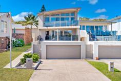 19 Graham Street Boat Harbour NSW 2316 Witness breathtaking views of Boat Harbour Beach whilst in the comfort of your own home, year-round. Unique in more ways than one, this stunning home is certainly a Port Stephens property not to be missed. Positioned in a tightly held pocket of Boat Harbour and only a short 130 meter walk out your front door to the white sands and crystal-clear water's edge, you will find yourself living a lifestyle most only dream of. The home itself is split over two levels with the first level comprised of 3 bedrooms, a bathroom, kitchenette and a loungeroom opening out to the first balcony. On the upper level you will find the heart of the home, with a master bedroom, ensuite and private balcony, a generous kitchen and the open plan dining and living room seamlessly leading you to the upper balcony. Enjoy every day from this residence with the jaw dropping views of Boat Harbour Beach from your dining table, loungeroom and vast balcony. Keep your eyes peeled and stretch your sight across to the Pacific Ocean where thousands of whales migrate up and down this spectacular coastline. This is the epitome of Beachside, Coastal living. - Ducted air-conditioning - Potential to holiday let the first level - Views from every level - 130m to the waters edge - 120m2 of garage and storage - Multiple balconies