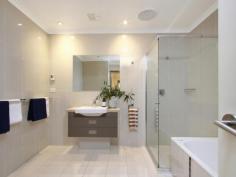 Unit 5/11 Howitt St The Avenue Kingston ACT 2604 $1,200,000 Situated in a highly regarded, quiet and private complex: "The Avenue" offers modern townhouse living in the heart of Kingston Village. Featuring quality updates throughout, this unique, Solar-efficient home has been fully renovated and presents as an ideal opportunity for the owner-occupier, downsizer or young family seeking access to blue-ribbon schools within the inner-south catchment area. With a highly functional floor plan, this townhouse features internal access from the remote-controlled garage into a full-sized Laundry, with adjacent powder room. There are also two separate living areas downstairs including a spacious dining room with adjacent Kitchen and separate lounge room with rear courtyard access. Energy efficiency is assured with quality double-glazed windows and additional insulation. Peace of mind for the security conscious is provided by Crim-safe window treatments. Unique to this home, there is an abundance of light from both the front and rear courtyards. Polished Tasmanian Blackbutt floor boards throughout are charmingly highlighted by exposed timber beams in the ceiling and the polished timber staircase. The living areas are serviced by reverse cycle heating and cooling providing year-round comfort. The well appointed kitchen overlooks the front courtyard and features plenty of cupboard space with an integrated Miele dishwasher, AEG brand induction cook top and built-in oven and microwave. Stone benchtops and contrasting splash backs accent the practicality of the Kitchen and a unique fold-out pantry complements the abundance of storage. There is also ample on-site visitor parking adjacent to the home and plenty of space to park a second car in front of your garage. The central staircase leads you to three well-proportioned bedrooms upstairs; each large enough for a Queen-sized bed. Due to this being an end-unit, the stairwell has the added advantage of a full length widow providing additional light throughout the home. The Master Bedroom has a walk-through robe providing access to the en-suite which includes a shower, toilet, custom-built vanity and in-slab heating. The 2nd and 3rd bedrooms also have built-in robes and there are internet and television connection points throughout the home. The master bedroom is segregated from the other two bedrooms by the family bathroom, which features new floor tiles, a custom-built vanity, shower, separate bath, large skylight and in-slab heating. In this fantastic location you will enjoy easy access to all amenities provided in the heart of Kingston, which is a mere five minute stroll away. You will be hard pressed to find anywhere else that can offer privacy, tranquility and an abundance of light-filled rooms and spacious living as you will find in this unique home. Features: North Facing, Three bedroom, two story townhouse Extensive fit-out of Solar Panels and back-to-grid inverter Polished Hardwood floors throughout Two separate living areas Fully renovated throughout with updated bathrooms, laundry, powder room and kitchen Two light filled courtyards Spacious Master with walk-through robe leading into an en-suite In-slab heating for both bathrooms Reverse cycle air conditioning ensures year-round comfort throughout the home Built in robes to all rooms Retractable awning over front courtyard Solar panels Additional car space and ample on-site visitor parking