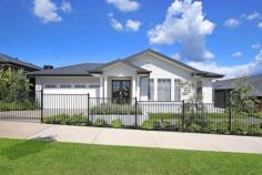 36 Hampshire Boulevard Leneva VIC 3691 $849,000 A luxuriously and spacious display home in a popular new estate with surrounding hill side views awaits it's first occupants. This executive family home where the outdoors is invited inside has an open plan living/dining through to the outdoor entertaining and alfresco. The quality home with four bedrooms features, a spacious master bedroom having a double ensuite with his and her walk-in wardrobes. A further three beautiful bedrooms all with built in wardrobes and close to a family bathroom / powder room. In addition to the standard features it has luxury extras, these include a gas fireplace with herringbone tile in the family room and great looking grey shaker cabinetry in the kitchen and butlers pantry. Quality stainless steel appliances with freestanding cooktop & oven 900mm, microwave, dishwasher & double door fridge are all included. Subtle metallic finishes and black highlights in the lighting and windows ramp up the WOW factor. Other features include family and games area, stylish laundry, alarm system, ducted heating and cooling for all year round comfort. Outside you will enjoy the built-in barbeque and low maintenance yard with watering system. If you're looking for a home with that extra extravagance you deserve, this is the one for you.