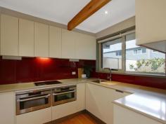Unit 5/11 Howitt St The Avenue Kingston ACT 2604 $1,200,000 Situated in a highly regarded, quiet and private complex: "The Avenue" offers modern townhouse living in the heart of Kingston Village. Featuring quality updates throughout, this unique, Solar-efficient home has been fully renovated and presents as an ideal opportunity for the owner-occupier, downsizer or young family seeking access to blue-ribbon schools within the inner-south catchment area. With a highly functional floor plan, this townhouse features internal access from the remote-controlled garage into a full-sized Laundry, with adjacent powder room. There are also two separate living areas downstairs including a spacious dining room with adjacent Kitchen and separate lounge room with rear courtyard access. Energy efficiency is assured with quality double-glazed windows and additional insulation. Peace of mind for the security conscious is provided by Crim-safe window treatments. Unique to this home, there is an abundance of light from both the front and rear courtyards. Polished Tasmanian Blackbutt floor boards throughout are charmingly highlighted by exposed timber beams in the ceiling and the polished timber staircase. The living areas are serviced by reverse cycle heating and cooling providing year-round comfort. The well appointed kitchen overlooks the front courtyard and features plenty of cupboard space with an integrated Miele dishwasher, AEG brand induction cook top and built-in oven and microwave. Stone benchtops and contrasting splash backs accent the practicality of the Kitchen and a unique fold-out pantry complements the abundance of storage. There is also ample on-site visitor parking adjacent to the home and plenty of space to park a second car in front of your garage. The central staircase leads you to three well-proportioned bedrooms upstairs; each large enough for a Queen-sized bed. Due to this being an end-unit, the stairwell has the added advantage of a full length widow providing additional light throughout the home. The Master Bedroom has a walk-through robe providing access to the en-suite which includes a shower, toilet, custom-built vanity and in-slab heating. The 2nd and 3rd bedrooms also have built-in robes and there are internet and television connection points throughout the home. The master bedroom is segregated from the other two bedrooms by the family bathroom, which features new floor tiles, a custom-built vanity, shower, separate bath, large skylight and in-slab heating. In this fantastic location you will enjoy easy access to all amenities provided in the heart of Kingston, which is a mere five minute stroll away. You will be hard pressed to find anywhere else that can offer privacy, tranquility and an abundance of light-filled rooms and spacious living as you will find in this unique home. Features: North Facing, Three bedroom, two story townhouse Extensive fit-out of Solar Panels and back-to-grid inverter Polished Hardwood floors throughout Two separate living areas Fully renovated throughout with updated bathrooms, laundry, powder room and kitchen Two light filled courtyards Spacious Master with walk-through robe leading into an en-suite In-slab heating for both bathrooms Reverse cycle air conditioning ensures year-round comfort throughout the home Built in robes to all rooms Retractable awning over front courtyard Solar panels Additional car space and ample on-site visitor parking