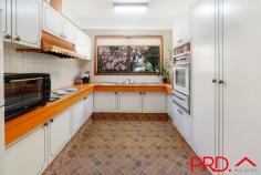 15B Marnola Crescent East Tamworth NSW 2340 $599,000 15b Marnola Crescent is tucked way under the hills, high in East Tamworth. Situated in a quiet cul-de-sac is this strong, well built brick home, with large established trees and gardens on a 784m2 block of land. The neighborhood is quiet and friendly, and situated amongst quality homes, close to childcare facilities, Calrossy School, Tamworth Public School and Anzac Park. A spacious lounge, dining and meals area all flow into the retro kitchen which has lovely views out into the yard. The kitchen is flooded with natural light and lots of cupboard space. Three bedrooms are located off the hallway and the bathroom has a separate toilet. A lovely covered patio area will be the place many hours of just sitting, entertaining, watching the kiddies in the pool or just a cuppa. The yard is fully fenced, private and includes a fernery, garden shed and in ground swimming pool with cover. The garage has access to this covered area which is very handy in the weather and at night. Included is a single lock up garage, plus carport spaces at the front of the block for additional car accommodation or trailer.