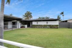 4 CREDLIN STREET SOUTH MACKAY QLD 4740 $525,000 The street scape at this divine property will have you enticed immediately with the huge, high clearance, skillion-style, double carport, perfect for caravans & sizeable boats. This massive carport also has the versatility to transform into an oversized workshop that enjoys constant seabreezes & has a lockable storage room within arm's reach! There are two entry points to the home: the formal entry which is surrounded by calming water features & a long breezeway filled with plants & greenery; or via the sliding glass screened doors leading from the garage into air-conditioned media room, which could also double as a home office, home gym, another bedroom or playroom for the kids. Constructed of painted concrete block, this property offers low maintenance & excellent insulation all year round, with clever design capturing cross breezes meandering through the entire house, over neutral, timeless tiles that are so easy to clean! Each room is generously sized with lots of natural light, with the main bedroom boasting a big 3 x slider built in robe. The bathroom is modern & practical with a walk-in shower, floating vanity, floor-to-ceiling tiles & as second toilet (1 toilet inside the bathroom, another toilet separate). The laundry offers access to the outdoor entertaining area which is perfect as children swimming in the pool don't need to track wet feet through the entire house - they can access the bathroom via the laundry. The long hallway opens to the unique & multi-faceted kitchen that offers many different cooking spaces, with breakfast benches, display benches, overhead & under bench storage, a 5-burner gas cooktop with electric oven, single drawer dishwasher & big double doored corner pantry! Cater quickly & easily by taking 5 steps to the outdoor entertaining area overlooking the beautiful inground pool, with high roof lines, fully concreted, BBQ area, protected pool pumps, fully fenced & shade sails to enjoy the water at all times of the day! Even with this enormous outdoor entertaining area, there is still a very large backyard with brand new lawn locker & wide side access if a bigger shed was desired. Situated only steps from the beach, blocks from Paget & a short drive to schools & the City, this property has it all - nearby facilities include Mackay Tennis Association, Harrup Park Cricket and Australian Rules Football Club, Mackay Junior Rugby League, Mackay Netball Association, BB Print Arena and Mackay Multi-sports Stadium.