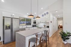 40 Avocet Ct Burpengary QLD 4505 $980,000 Set on a glorious 3,386 sqm this renovated low-set family home will delight. with raked ceilings neutral tones and contemporary fixtures and fitting you will know you have found your new place called home. The sought-after northerly aspect of the home combined with the oversized windows and sliders, the home is light, bright, and airy creating a tranquil, warm ambiance. The central hub of the home is open plan and seamlessly integrates with the huge, covered patio making entertaining family and friends a breeze. The galley style kitchen offers a suite of stainless-steel appliances, generous bench space and the centre island incorporates a breakfast bench. This vibrant space is complete with feature pendulum lights and subway tile splash back. Accommodation comprises of 4 bedrooms. The master suite is complete with a walk-in wardrobe and ensuite, the perfect parent's retreat. The remaining three bedrooms,one with a walk-in robe, are serviced by the family bathroom, which includes a floating bath tub. Additional features include:- - Huge covered alfresco patio, perfect for year-round living - Built-in study area - Split system air-conditioning and ceiling fans - Internal laundry with direct access to the drying area - Double carport with covered access to the front door - Double garage, garden shed Let the children run free whilst only minutes away from schools, shopping, and the motorway. This is a sought-after lifestyle, and 40 Avocet Court is offering you the opportunity to make it yours. Put it at the top of your list and start packing the boxes.