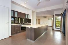 25 Bin Sallik Avenue Cable Beach WA 6726 $639,000 Flexible, functional and feature-filled, there are many words you can use to describe this spacious and stylish 4 bed, 2 bath home but one word stands out above the rest: impressive. Beautifully crafted and presented near new, the home is the definition of modern, low-maintenance family living. From the front, the home boasts great streel appeal thanks to its mature tropical gardens and towering palms. The large double carport has room for two large vehicles with additional driveway parking and gated side access for secure boat, caravan or trailer storage. Thoughtfully considered and carefully crafted, you'll discover detailed features and finishes throughout the interior from the architectural ceilings, louvre windows, downlights, modern tiled floorings and an earthy colour scheme. Open-plan living and dining areas offer plenty of space with no shortage of natural light and breezes flowing through. At the heart of the home is the modern and magnificent kitchen boasting stainless steel appliances, gas cooktop, built-in pantry, soft-close drawers, underbench power point and floating breakfast bar. Other key features include the big main bathroom, separate laundry, beautiful portico entry, air-conditioning, ceiling fans, modern downlights, louvre windows and plenty of internal storage space. The home itself boasts 4 large bedrooms, all with built-in robes, including the very generous master suite complete with walk-in robe, private ensuite and double feature doors opening onto the private rear balcony. Thoughtfully designed both inside and out, the expansive undercover alfresco offers the ideal outdoor living space overlooking the large rear yard with easy-care tropical gardens. There's more than enough room for a pool and a massive rear shed for all of your tools and toys. Located just a short walk through the dunes to Cable Beach, and close to local primary schools, shops and Cable Beach's famous strip of restaurants and bars, the prime location only adds to this home's glowing appeal.